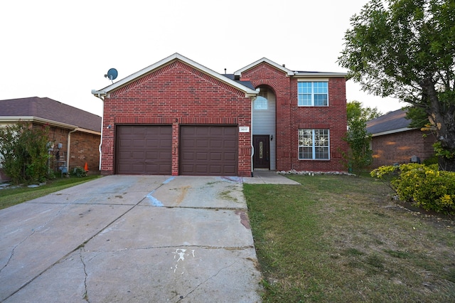 view of front property featuring a garage and a front yard