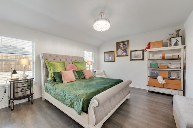 bedroom featuring vaulted ceiling and dark hardwood / wood-style floors