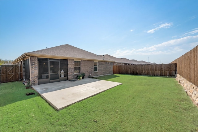 rear view of house with outdoor lounge area, a lawn, and a patio area