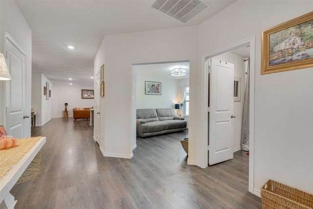 corridor featuring hardwood / wood-style flooring