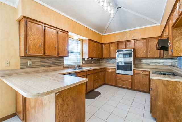 kitchen featuring ventilation hood, kitchen peninsula, a textured ceiling, and lofted ceiling