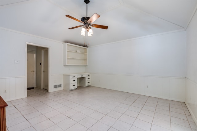 tiled empty room with vaulted ceiling and ceiling fan