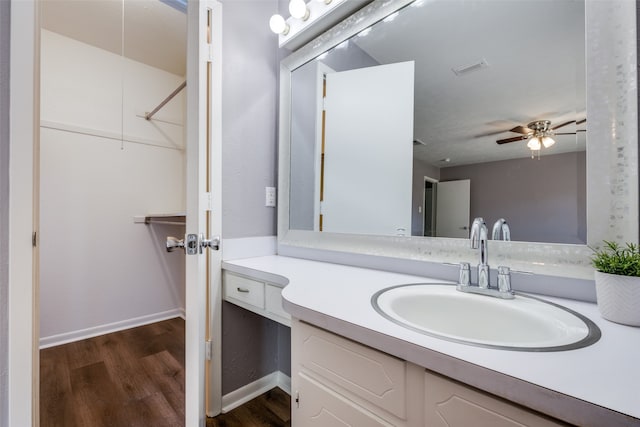 bathroom featuring ceiling fan, vanity, and hardwood / wood-style flooring