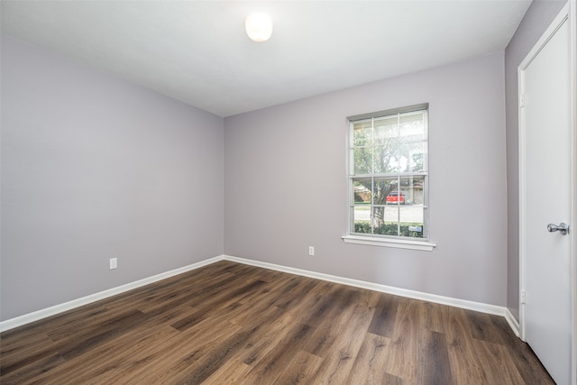 unfurnished room featuring dark hardwood / wood-style floors