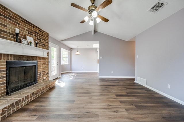 unfurnished living room featuring a fireplace, ceiling fan, dark hardwood / wood-style flooring, and vaulted ceiling