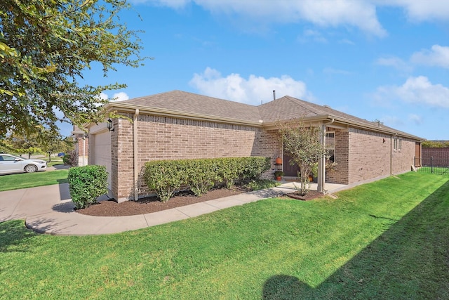 view of home's exterior featuring a garage and a lawn