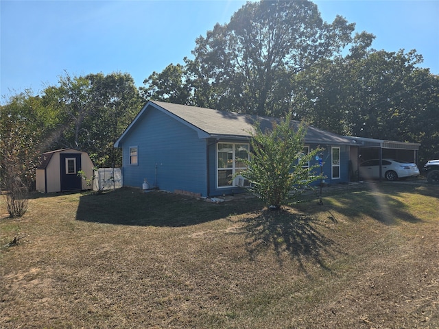 view of home's exterior featuring a carport, a yard, and a shed