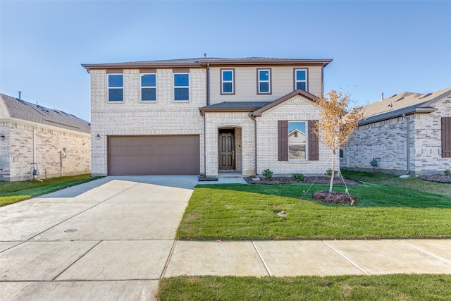 front of property with a front yard and a garage