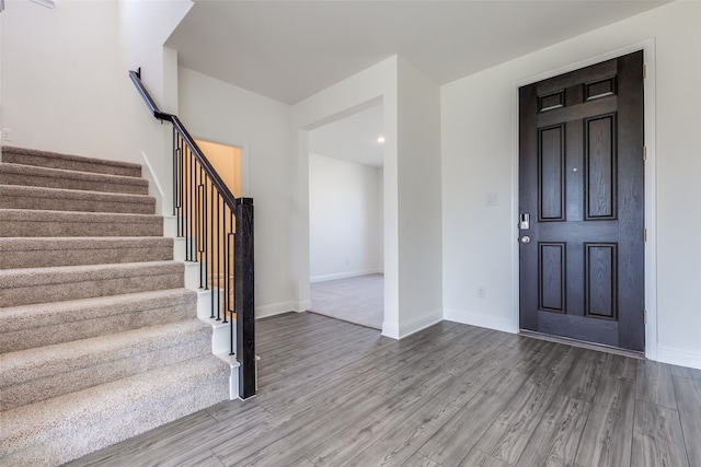 foyer entrance with wood-type flooring