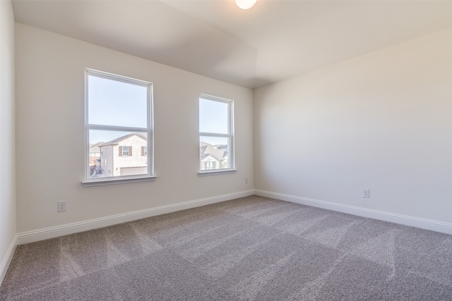 unfurnished room featuring carpet flooring