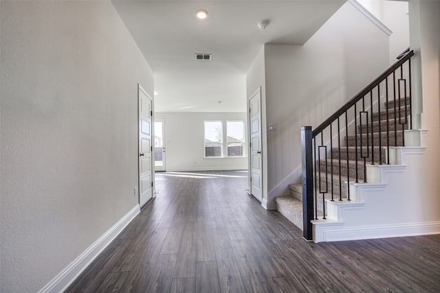 foyer entrance with dark wood-type flooring