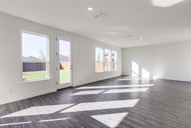 unfurnished room featuring dark hardwood / wood-style flooring