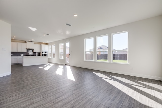 unfurnished living room featuring light wood-type flooring