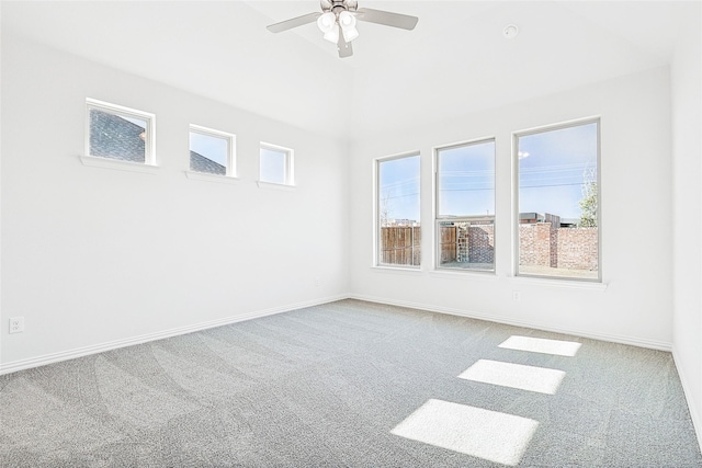 empty room featuring ceiling fan and carpet