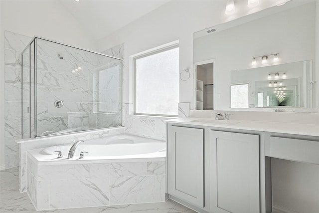 bathroom with vanity, lofted ceiling, and plus walk in shower