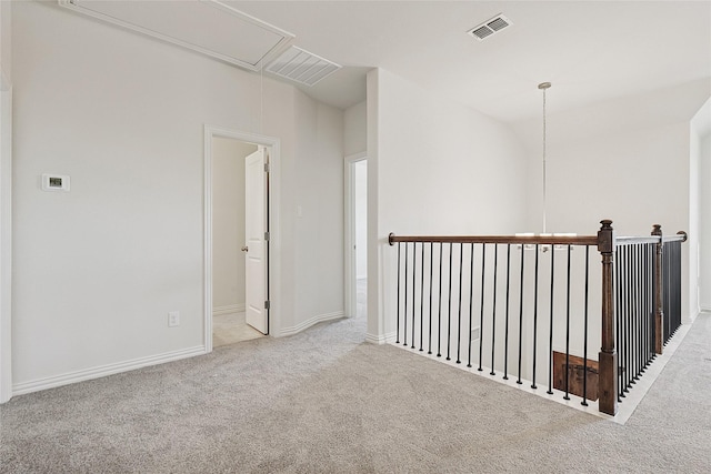 hallway featuring light carpet