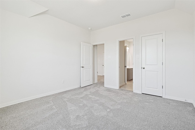 unfurnished bedroom with light colored carpet