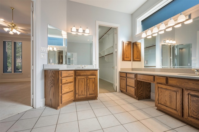 bathroom featuring tile patterned floors, ceiling fan, and vanity