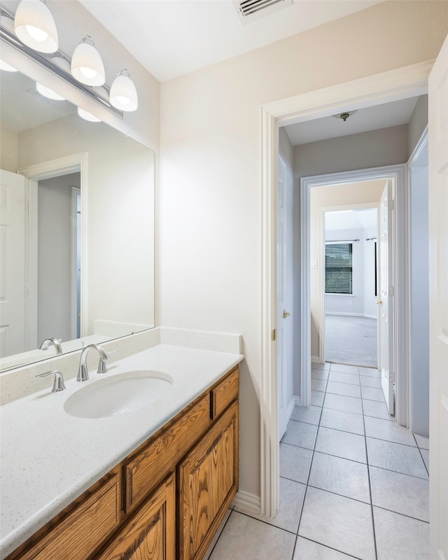 bathroom featuring tile patterned floors and vanity