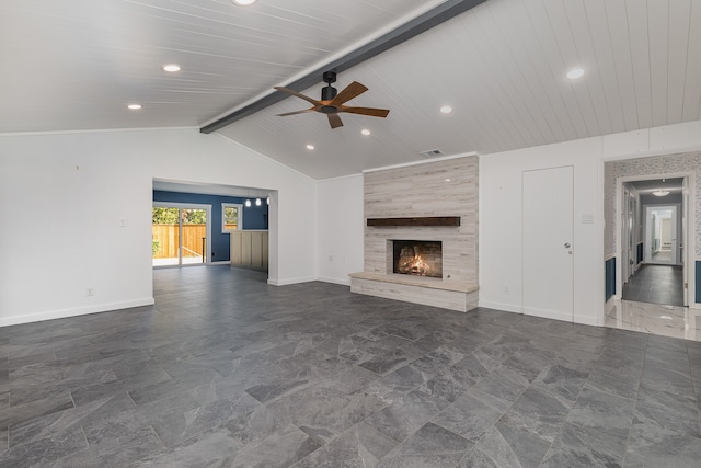 unfurnished living room with a large fireplace, wooden ceiling, lofted ceiling with beams, and ceiling fan