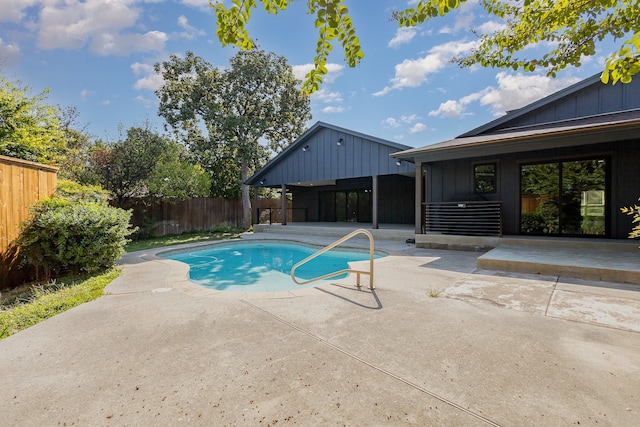 view of swimming pool with a patio area