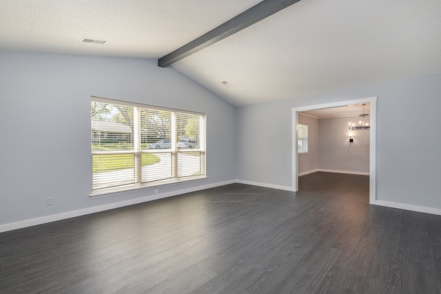 spare room featuring vaulted ceiling with beams, dark wood-type flooring, a chandelier, and a textured ceiling