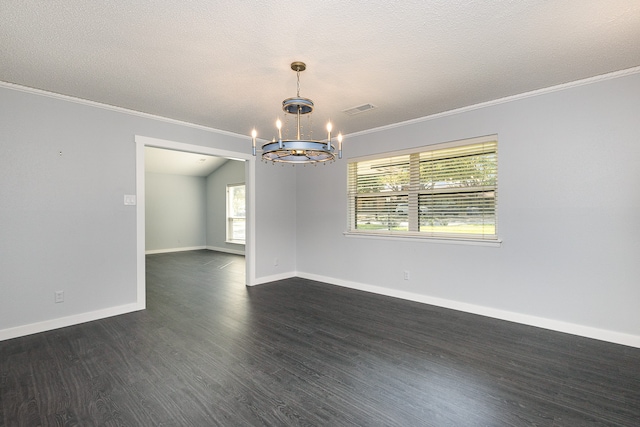 empty room with dark wood-type flooring, ornamental molding, an inviting chandelier, and a wealth of natural light