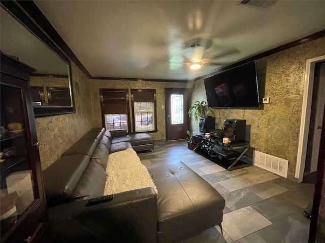 living room with ceiling fan and crown molding