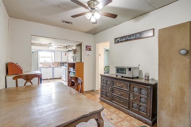 dining area featuring ceiling fan and light parquet floors