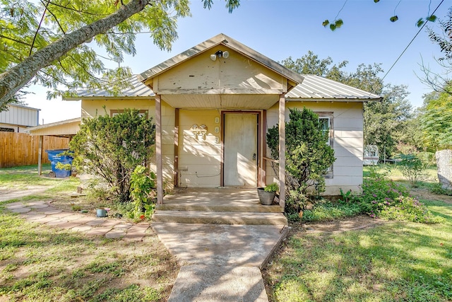 view of front of home with a garage and a front lawn