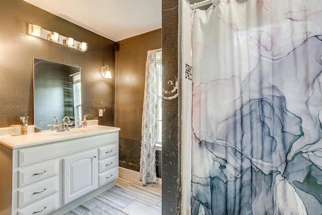 bathroom featuring vanity and a shower with shower curtain