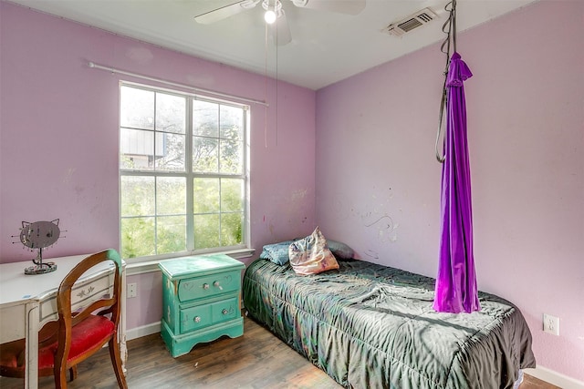 bedroom featuring ceiling fan and hardwood / wood-style floors