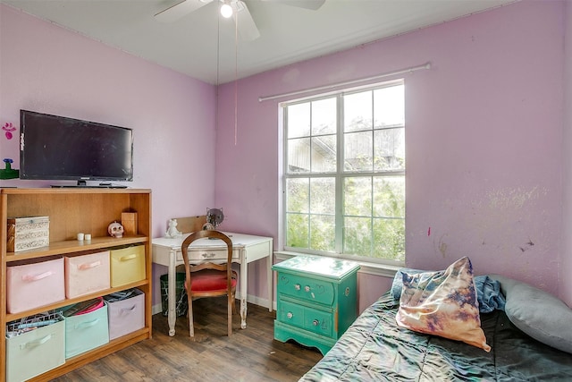 bedroom with ceiling fan and dark hardwood / wood-style floors