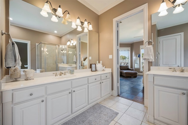 bathroom with vanity, ornamental molding, and walk in shower