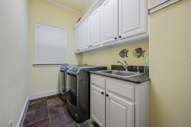 laundry area with cabinets, independent washer and dryer, ornamental molding, and sink