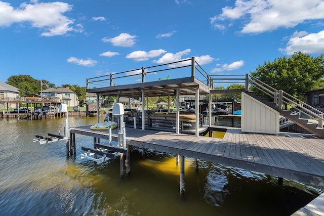 dock area with a water view