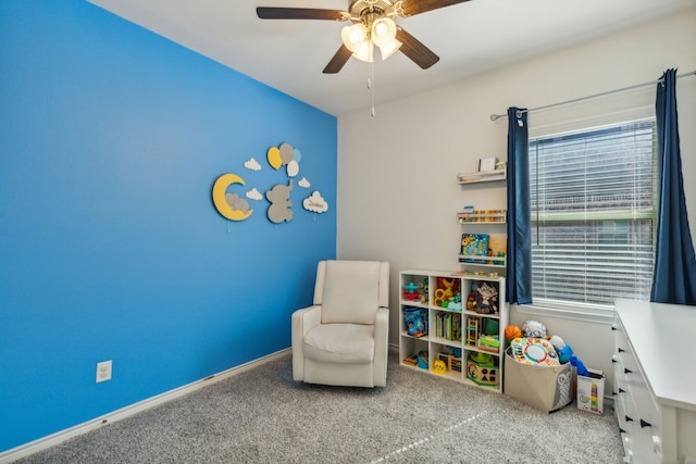 rec room featuring light colored carpet and ceiling fan