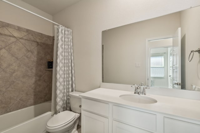 full bathroom featuring vanity, shower / tub combo with curtain, and toilet