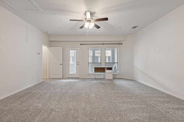 unfurnished living room featuring ceiling fan and carpet floors