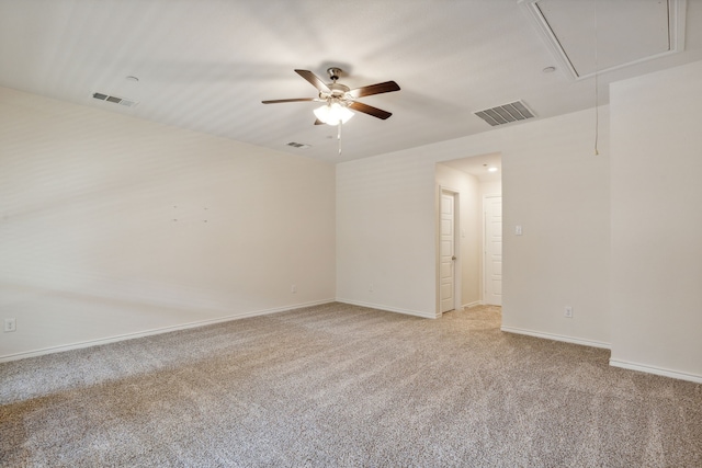 unfurnished room featuring light colored carpet and ceiling fan