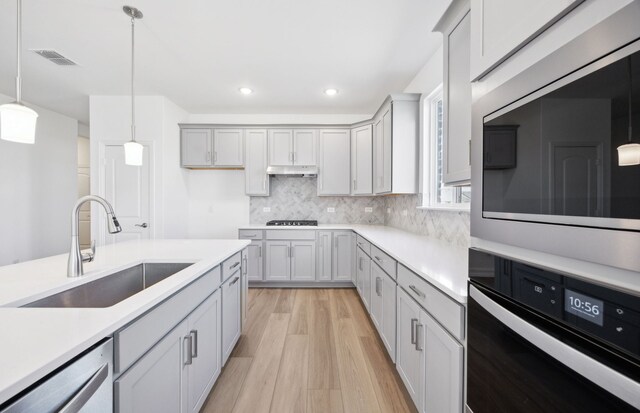 dining area featuring light hardwood / wood-style floors and sink