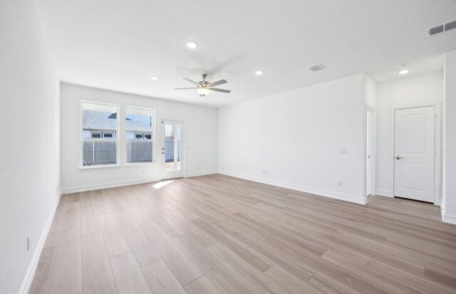 dining area with light hardwood / wood-style flooring, a fireplace, and a tray ceiling