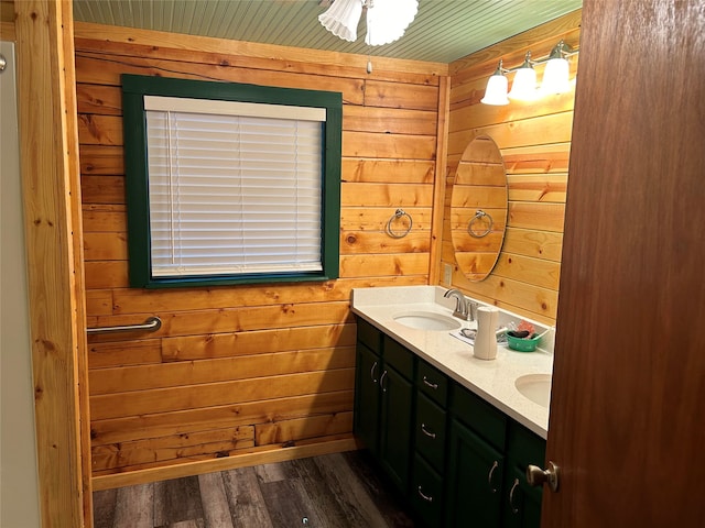 bathroom featuring wood-type flooring, wood ceiling, vanity, and wooden walls