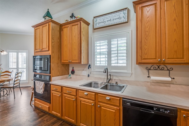 kitchen featuring dark wood-type flooring, sink, black appliances, and ornamental molding