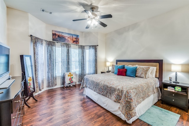 bedroom featuring dark hardwood / wood-style flooring and ceiling fan