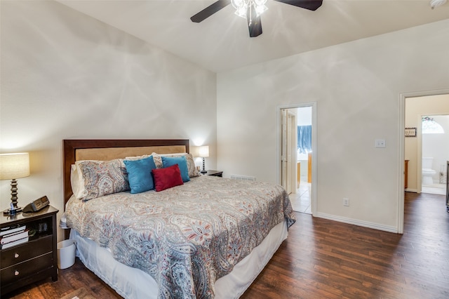 bedroom with ensuite bathroom, ceiling fan, and dark wood-type flooring