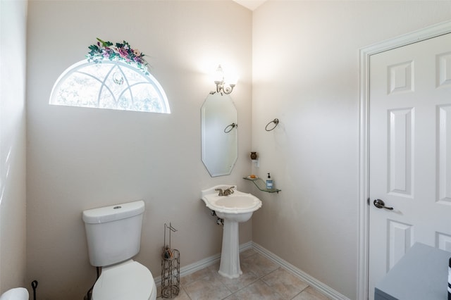 bathroom featuring tile patterned floors and toilet