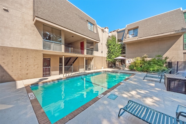 view of swimming pool with a patio