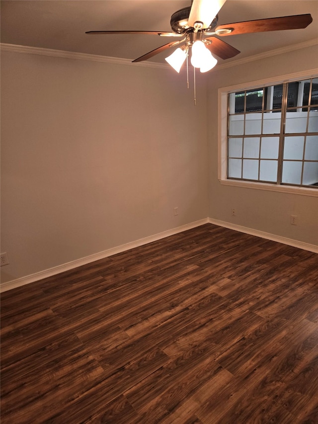 unfurnished room with ceiling fan, crown molding, and dark wood-type flooring