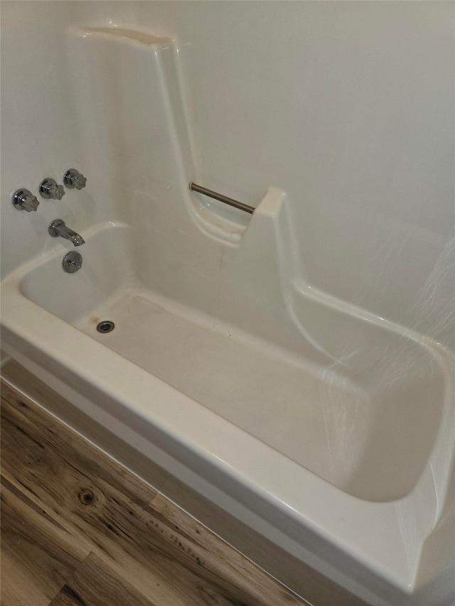 bathroom with wood-type flooring